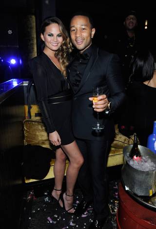 Singer John Legend, with model wife Chrissy Teigen, hosts at Haze on Tuesday, Dec. 31, 2013, in Aria.