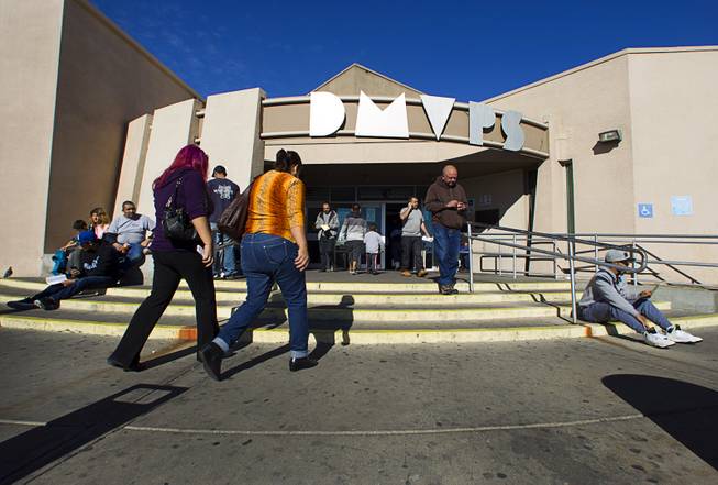 People head into the Department of Motor Vehicles office on East Sahara Avenue Thursday, Jan. 2, 2014. 