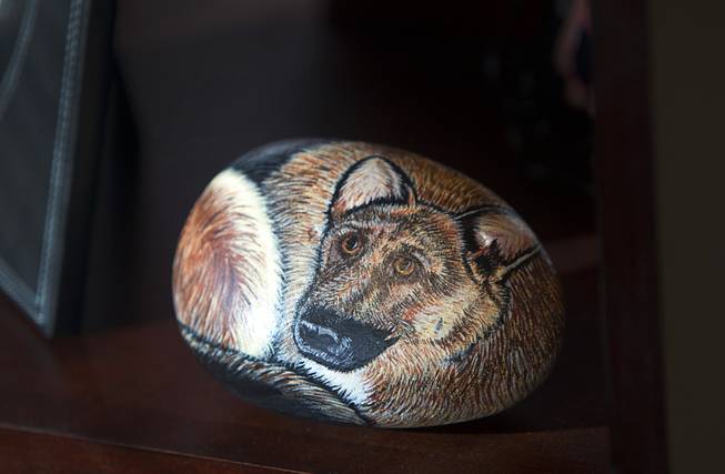Stone art featuring an image of Danko, Sheriff Doug Gillespie's police dog, is shown on a shelf at his office in Metro Police Headquarters Thursday, Jan. 2, 2014.  Gillespie was a K-9 officer from 1990 to 1993 and adopted  Danko after the dog retired. Danko passed away in 1997.