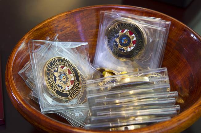Challenge coins are shown in Sheriff Doug Gillespie's office in Metro Police Headquarters Thursday, Jan. 2, 2014.
