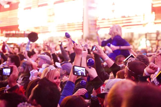 Fans cheer on Papa Roach during New Year’s Eve festivities at the Fremont Street Experience in downtown Las Vegas, Dec. 31, 2013. An estimated 335,000 tourists were expected to visit Las Vegas to celebrate the new year.