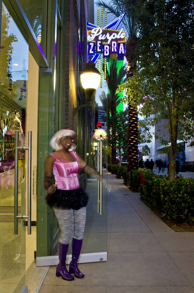 Shatevia Boykin of the Purple Zebra welcomes guests to one of the stores in operation on The Linq shopping and food area between The Quad and The Flamingo on Friday, Jan. 3, 2014.