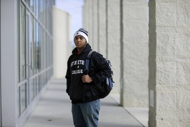 Political science student La'Shon Callaway, 19, of Egg Harbor Township, N.J., poses for a photograph as he stands on the campus of the Richard Stockton College of New Jersey, in Galloway, N.J., Tuesday, Dec. 31, 2013. 