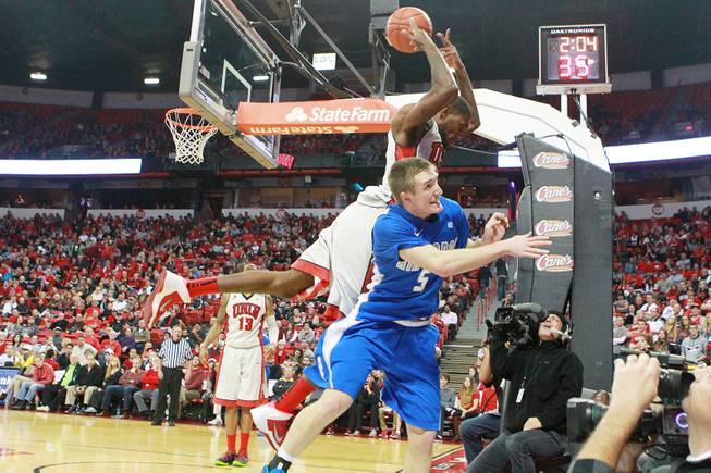 After deflecting Air Force guard Zach Kocur's inbounds pass, UNLV forward Roscoe Smith leaps to keep the ball in play during their Mountain West Conference game Saturday, Jan. 4, 2014 at the Thomas & Mack Center.