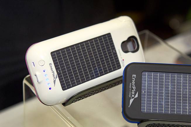 Smartphone cases with solar photovoltaic cells by EnerPlex are displayed during "CES Unveiled," a media preview event to the annual Consumer Electronics Show (CES), in Las Vegas, Jan. 5, 2014. The cases retail for $89.99-$99.99 depending on the model.