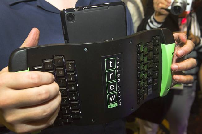 A TREWGrip keyboard is shown during "CES Unveiled," a media preview event to the annual Consumer Electronics Show (CES), in Las Vegas, Jan. 5, 2014. The keyboard keys face away from the user but allows people to type and enter data into a tablet while standing up.