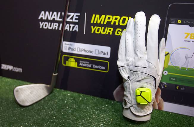 A Zepp sensor is shown on a golf glove during "CES Unveiled," a media preview event to the annual Consumer Electronics Show (CES), in Las Vegas, Jan. 5, 2014. The sensors, available for golf, baseball and tennis, analyze 1,000 data points per second to create 3D representations of a player's swing, a representative said. The sensors retail for $149.99, he said.