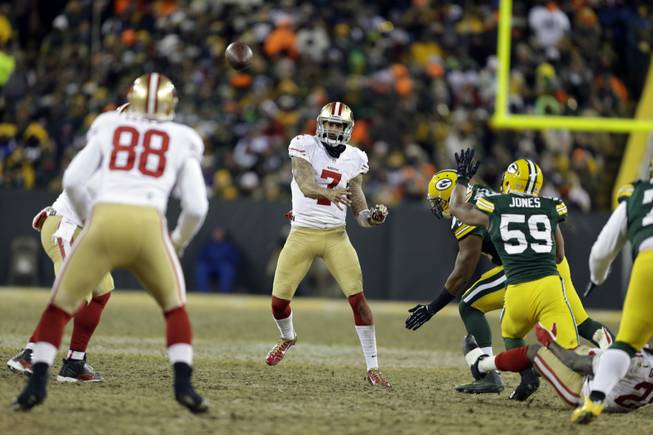 San Francisco 49ers quarterback Colin Kaepernick throws a pass during the second half of an NFL wild-card playoff game against the Green Bay Packers on Sunday, Jan. 5, 2014, in Green Bay, Wis.