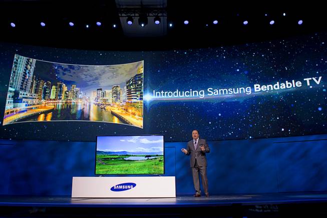 Joe Stinziano, executive vice president of Samsung Electronics of America, introduces a bendable television during the International Consumer Electronics Show (CES), in Las Vegas, Monday Jan. 6, 2014. The television changes from a flat screen to a curved screen at the touch of a button.
