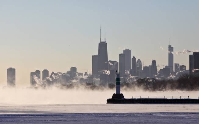 A blanket of fog covers Lake Michigan along the Chicago shoreline Monday, Jan. 6, 2014 as temperatures dove well below zero and wind chills were expected to reach 40 to 50 below.  A whirlpool of frigid, dense air known as a "polar vortex" descended Monday into much of the U.S.