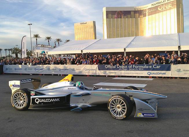 A new all-electric raceccar, the Spark-Renault SRT 01E Formula E, is taken on a demonstration drive by Brazilian Formula One driver Lucas di Grassi on the grounds of Mandalay Bay on Monday, Jan. 6, 2014.