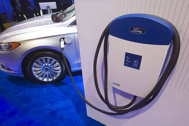 An electric vehicle charger is displayed at the Ford booth during the 2014 International Consumer Electronics Show (CES) at Las Vegas Convention Center in Las Vegas, Tuesday Jan. 7, 2014.