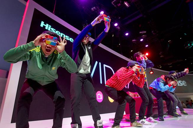 A dance group performs on the Hisense stage during the 2014 International Consumer Electronics Show (CES) in Las Vegas, Tuesday Jan. 7, 2014.