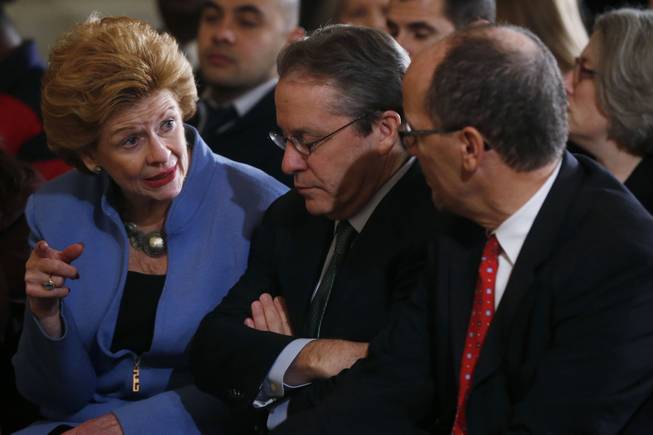 Sen. Debbie Stabenow, D-Mich., left, talks with White House National Economic Council Director Gene Sperling, center, as Labor Secretary Thomas Perez, right, before President Barack Obama spoke about benefits for the unemployed, Tuesday, Jan. 7, 2014, in the East Room at the White House in Washington.    