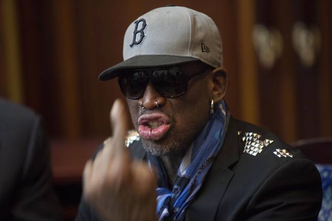 Dennis Rodman speaks with fellow US basketball players during a team meeting at a Pyongyang, North Korea hotel Tuesday, Jan. 7, 2014. Rodman came to the North Korean capital with a team of USA basketball stars for an exhibition game on Jan. 8, the birthday of North Korean leader Kim Jong Un.