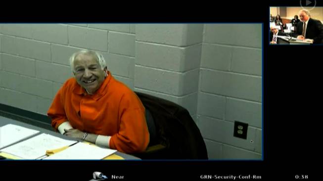 This video framegrab provided by the courthouse pool via Commonwealth Media Services shows Jerry Sandusky describing his career and retirement from Penn State by video link from Greene State Prison in southwestern Pennsylvania, Tuesday, Jan. 7, 2014, as testimony began in a hearing into whether he can get back the retirement benefits he lost after being convicted of child molestation.