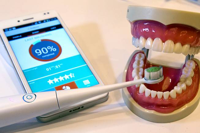 A Kolibree connected electric toothbrush is displayed during the 2014 International Consumer Electronics Show (CES) in Las Vegas, Jan. 8, 2014. The smart toothbrush uses an accelerometer, gyroscope and magnetometer to track how well the user brushes their teeth. The French company expects the toothbrush will be available in the third quarter of 2014 and retail for $99.00 to $199.00 depending on the model.