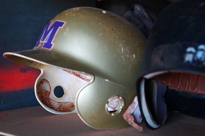 Of the batting helmets that weren't stolen from Sunrise Mountain High School, most are not usable because of lack of padding, such as this one seen Wednesday, Jan. 8, 2014.