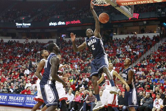 UNR guard Jerry Evans Jr. dunks on UNLV to finish the first half of their Mountain West Conference game Wednesday, Jan. 8, 2014 at the Thomas & Mack Center.