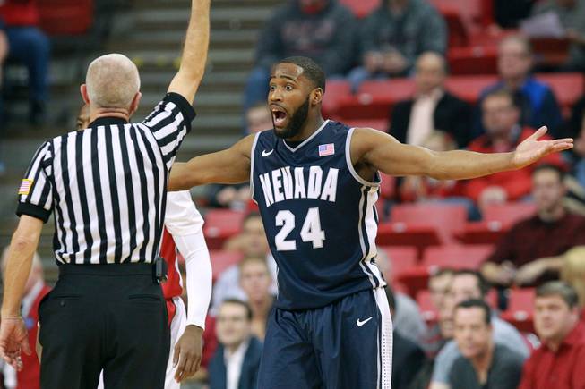 UNR guard Deonte Burton offers a different interpretation of an officials call during their Mountain West Conference game Wednesday, Jan. 8, 2014 at the Thomas & Mack Center.