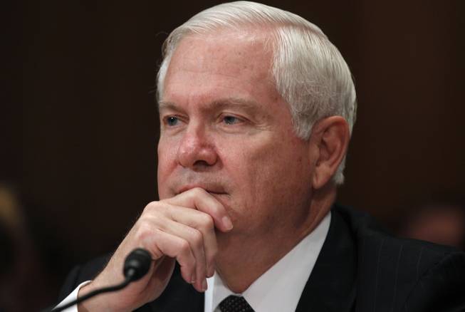In this June 15, 2011, file photo, then-Secretary of Defense Robert Gates testifies regarding the Department of Defense Fiscal Year 2012 budget request before the Senate Appropriations Committee Subcommittee on Defense on Capitol Hill in Washington.