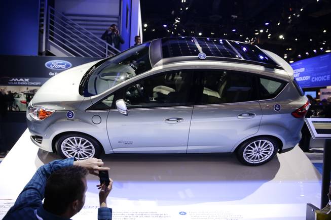 The Ford C-MAX Solar Energi Concept car is unveiled at the International Consumer Electronics Show on Tuesday, Jan. 7, 2014, in Las Vegas.