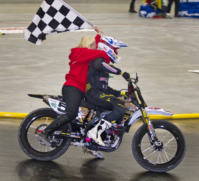 Rider Mike Rush (54) takes a victory lap after winning the Open Class finals of the West Coast Flat Track Series Races at South Point on Friday, Jan. 10, 2014.