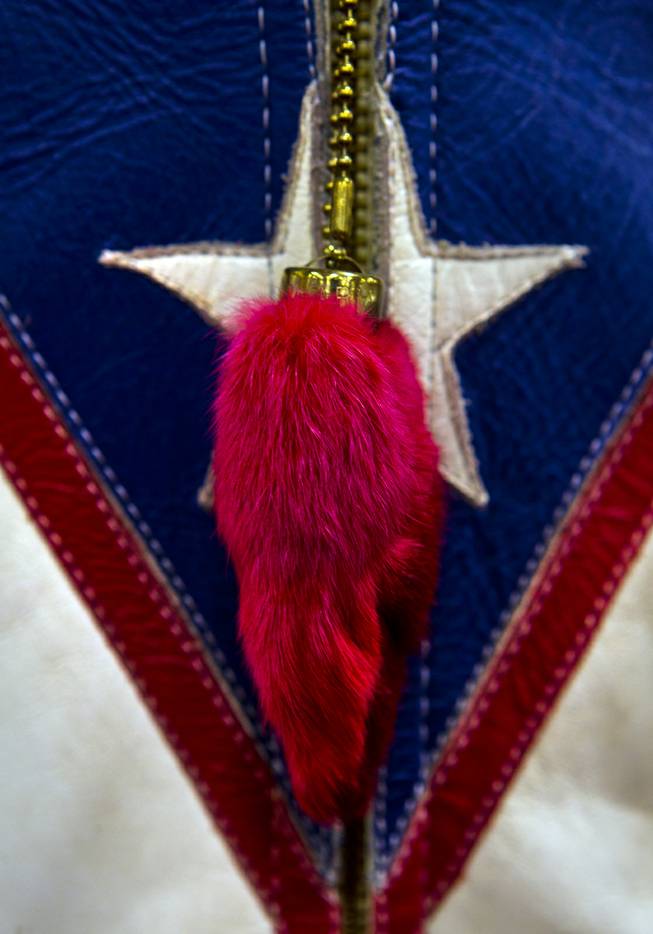 A rabbit's foot hangs from Evel Knievel's leather motorcycle riding suit on display as South Point hosts the 23rd Annual Las Vegas Vintage Motorcycle Auction on Friday, Jan. 10, 2014.
