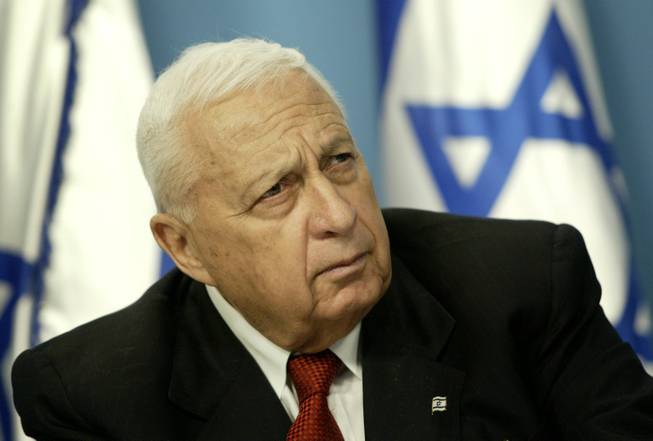 In this Sunday May 16, 2004, file photo, Israeli Prime Minister Ariel Sharon pauses during a news conference in his Jerusalem office regarding education reform. Sharon, the hard-charging Israeli general and prime minister who was admired and hated for his battlefield exploits and ambitions to reshape the Middle East, died Saturday, Jan. 11, 2014. The 85-year-old Sharon had been in a coma since a debilitating stroke eight years ago.