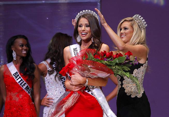 2014 Miss Nevada USA Nia Sanchez  is crowned by 2013 Miss Nevada USA Chelsea Caswell during the 2014 Miss Nevada USA Pageant on Sunday, Jan. 12, 2014, at UNLV.