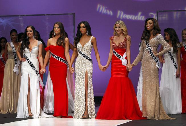 Finalists, from left, Jessica Davis, Nia Sanchez, Brittany McGowan, Stephanie Cook, and Cierrra Jackson, wait on stage during the Miss Nevada USA pageant at UNLV Sunday, Jan. 12, 2014. Sanchez was later named Miss Nevada USA.