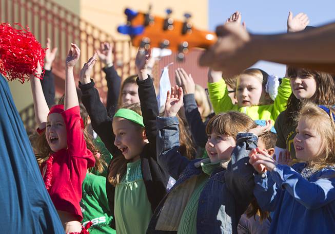 Children sing during a news conference to "unveil" a solar photovoltaic field at Congregation Ner Tamid in Henderson Sunday, Jan. 12, 2014. The $1.6 million project, a partnership of Congregation Ner Tamid, NV Energy and Hamilton Solar, will produce about 75 percent of the temple's power usage on average, said Matthew Weinberger, Hamilton Solar's director of business development.