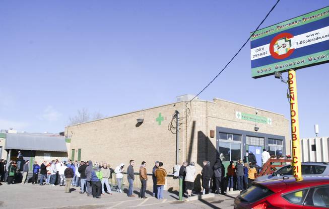 About 85 people wait in line on Jan. 2, 2014, at the 3D Cannabis Center near downtown Denver, one of 36 marijuana dispensaries that opened in Colorado on New Year's Day.