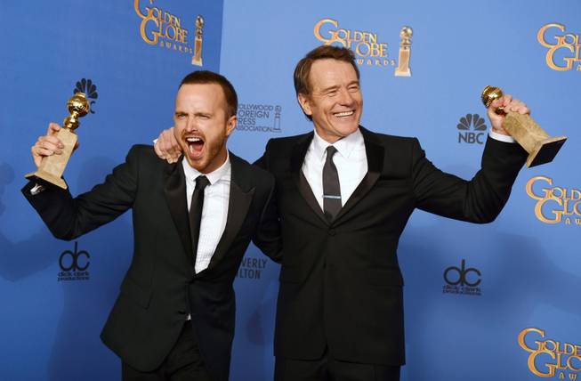 Aaron Paul, left, and Bryan Cranston pose in the press room with the award for best TV series - drama for "Breaking Bad" at the 71st annual Golden Globe Awards at the Beverly Hilton Hotel on Sunday, Jan. 12, 2014, in Beverly Hills, Calif.