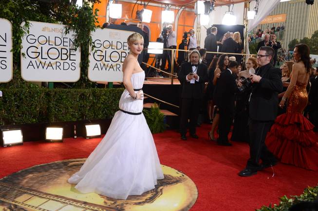 Jennifer Lawrence arrives at the 71st Annual Golden Globe Awards at the Beverly Hilton Hotel on Sunday, Jan. 12, 2014, in Beverly Hills, Calif. 