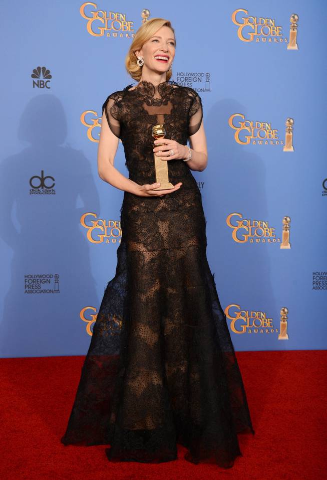 Cate Blanchett poses in the press room with the award for best actress in a motion picture - drama for "Blue Jasmine" at the 71st annual Golden Globe Awards at the Beverly Hilton Hotel on Sunday, Jan. 12, 2014, in Beverly Hills, Calif. 