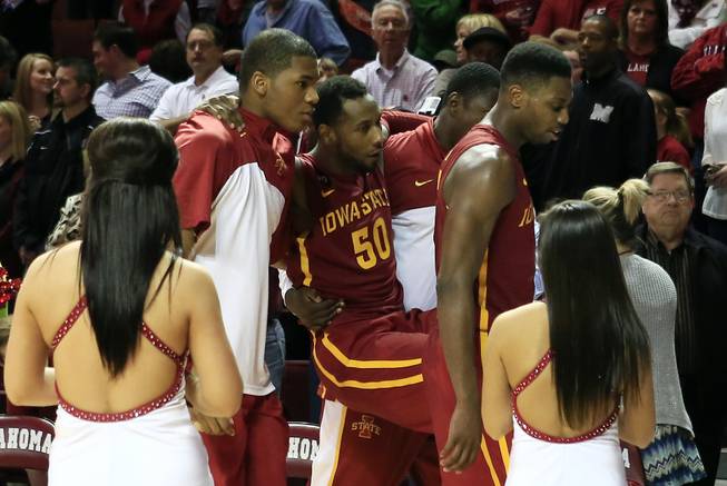 Iowa State guard DeAndre Kane is carried off the floor due to an injury following a loss to Oklahoma in an NCAA college basketball game in Norman, Okla., on Saturday, Jan. 11, 2014. Oklahoma won 87-82.