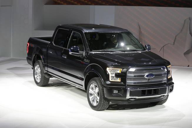 Ford unveils the new F-150 with a body built almost entirely out of aluminum at the North American International Auto Show in Detroit, Monday, Jan. 13, 2014.