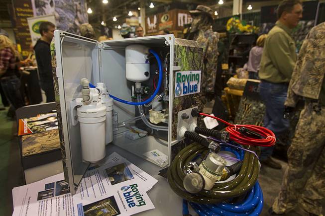 A Roving Blue portable water purifying system is displayed during the 2014 SHOT Show (Shooting, Hunting, Outdoor Trade) at the Sands Expo & Convention Center Tuesday, Jan. 14, 2014. The system, which weighs less than 15 pounds and is powered by a 12-volt battery, can produce one liter of purified water per minute.