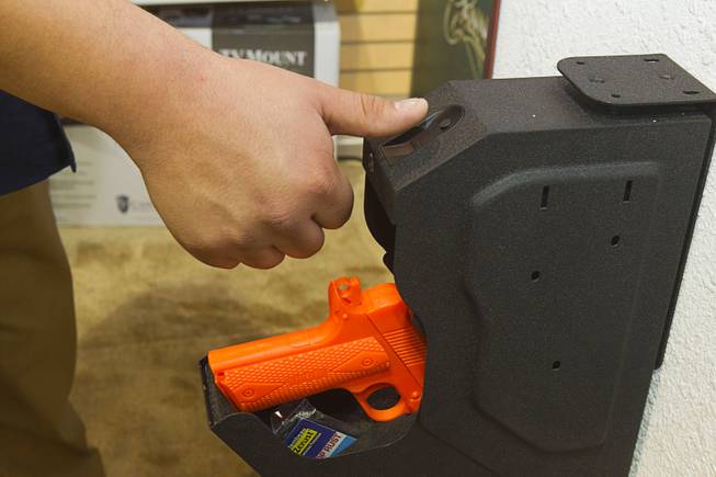 A SpeedVault gun safe with fingerprint scanner is displayed during the 2014 SHOT Show (Shooting, Hunting, Outdoor Trade) at the Sands Expo & Convention Center Tuesday, Jan. 14, 2014. The $299.99 safe can store up to 100 fingerprints