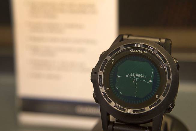 A Garmin Tactix GPS watch is displayed during the 2014 SHOT Show (Shooting, Hunting, Outdoor Trade) at the Sands Expo & Convention Center Tuesday, Jan. 14, 2014. The $449.99 watch is packed with features including an altimeter, a barometer, a 3-axis compass and temperature sensor. It also comes preloaded with U.S. tidal information and jump software for skydivers.