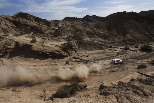 Mini driver Martin Kaczmarski of Poland and co-pilot Filipe Palmeiro of Portugal race during the fourth stage of the Dakar Rally between the cities of San Juan and Chilecito, Argentina, Wednesday, Jan. 8, 2014.