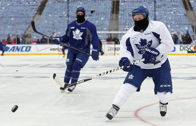 Toronto Maple Leafs forward Phil Kessel (81) shoots during practice on the outdoor rink for Wednesday's NHL Winter Classic hockey game against the Detroit Red Wings at Michigan Stadium in Ann Arbor, Mich., Tuesday, Dec. 31, 2013.