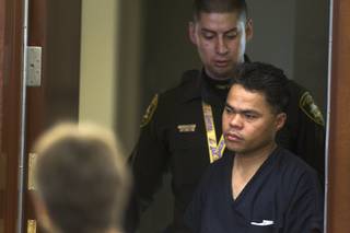 Richard Magdayo Dahan enters the courtroom at the Regional Justice Center Wednesday, Jan. 15, 2014. Dahan is accused of killing his wife Friday then driving to a Metro police station and turning himself in.