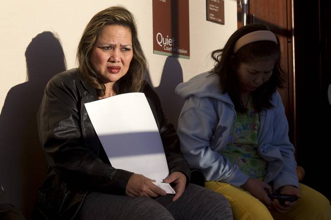Elizabeth Fisher, left, waits with co-workers before court at the Regional Justice Center Wednesday, Jan. 15, 2014. Richard Magdayo Dahan is accused of killing his wife Daisy on Friday, then driving to a Metro police station and turning himself in. Fisher worked with Daisy Dahan at the Lifecare Center of Las Vegas, she said.
