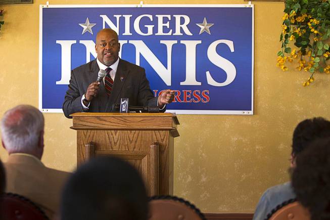 Republican Niger Innis responds to a reporter's question after announcing he is running for Congress at Leticia's Cocina, a Mexican restaurant near Highway 95 and Durango Dr., Wednesday, Jan. 15, 2014. Innis will challenge Democrat Steven Horsford for the seat.