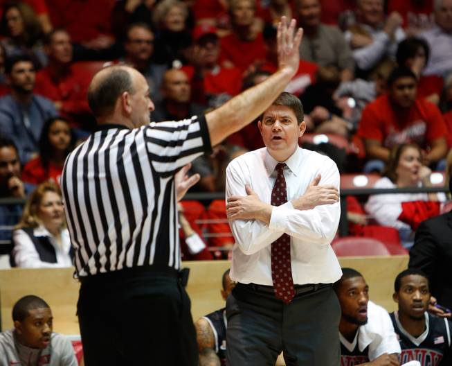 UNLV's head coach Dave Rice reacts to a call from the official in the first half of an NCAA college basketball game Wednesday, Jan. 15, 2014 in Albuquerque, N.M. UNLV won 76-73.