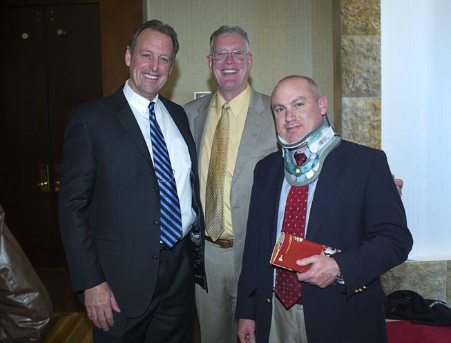 North Las Vegas Mayor John Lee, left, poses with Henderson Mayor Andy Hafen, center, and Boulder City Mayor Roger Tobler after the North Las Vegas State of the City Address at Aliante Casino in North Las Vegas, Jan. 16, 2014. Tobler is recovering from back surgery.