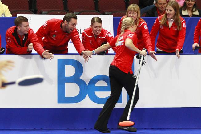 Anna Sloan is congratulated after her team won their match during the first day of the 2014 World Financial Group Continental Cup of Curling at the Orleans Arena Thursday, Jan. 16, 2014. Of the twelve teams competing from around the world, nine of them will represent their respective country at the upcoming Olympics in Sochi, Russia.