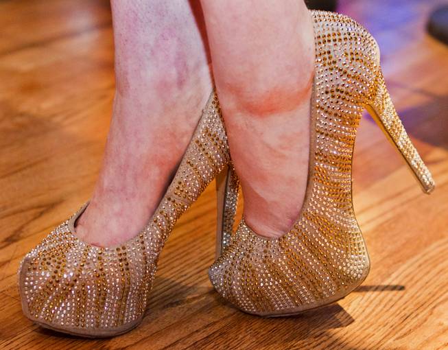 Gold and glittery shoes are worn for the AVN Adult Entertainment Expo happening at the Hard Rock Hotel & Casino on Thursday , Jan. 16, 2014.